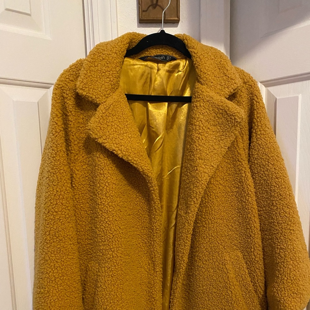 yellow sherpa like coat